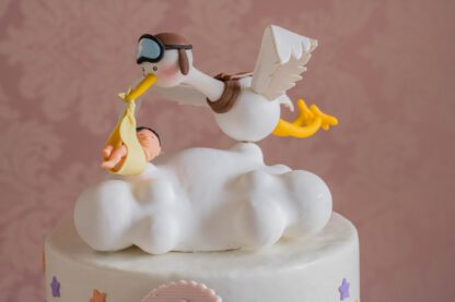 Baby shower cake with a stork carring a baby